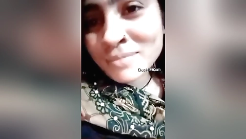 Sexy brunette babe with big boobs camouflages in solo