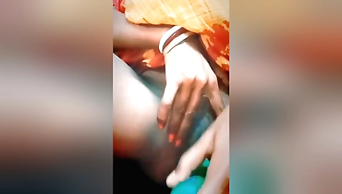 Solo girl masturbates with a toy on her hairy pussy