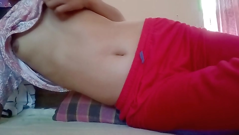 Amateur solo video in which a young brunette plays with herself