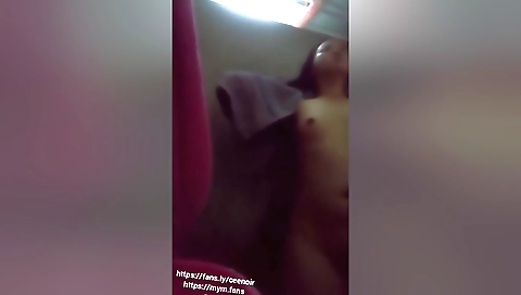 Indian girl showering in the shower in her bathroom