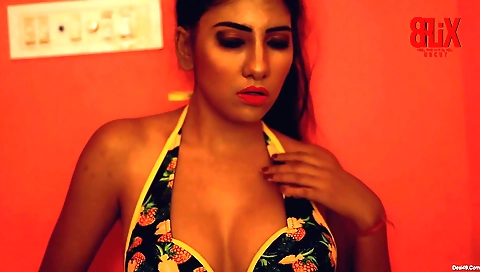 Sexy brunette woman in sexy black dress is in her room