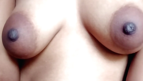 Indian girl plays with her favorite toy in her bedroom