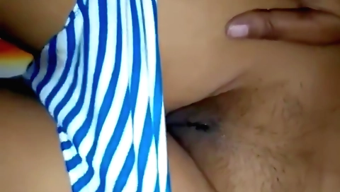 Busty Indian teen with hairy pussy burns her wet pussy