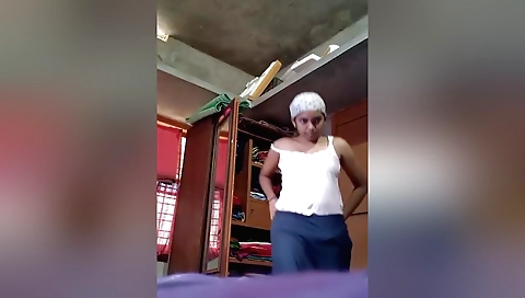 Solo brunette girl with a cute little dollhouse in living room