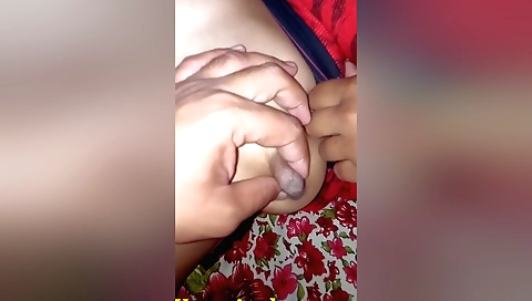 Amateur wife enjoys having her nipples rubbed by husband