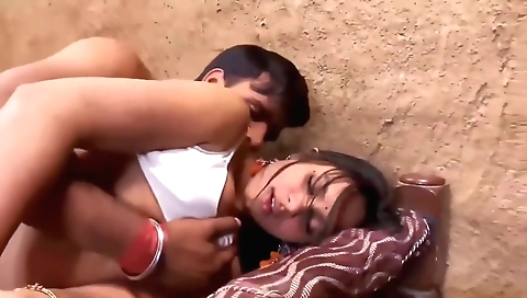 Indian brunette fucks her boyfriend in bed in the bedroom