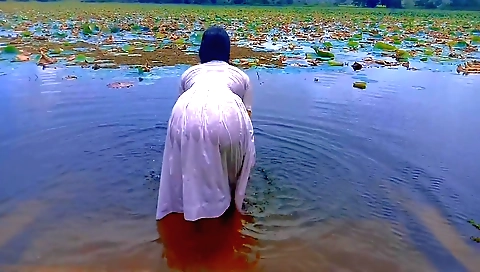 Stunning girl naked in the park and takes off her pantyhose