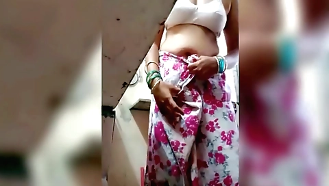 Indian school girl shows off her body on the kitchen floor