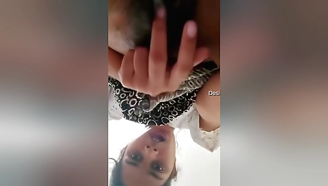 Indian chick spreads legs wide and sucks her pussy