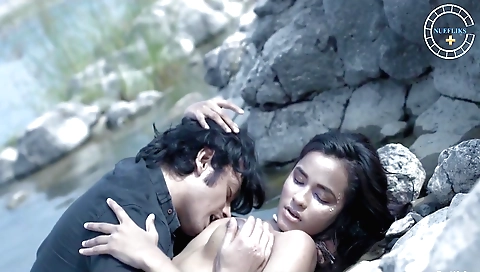 Brunette girl is in the rain outside with a camera