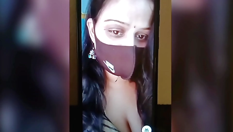 Indian beauty is talking on her phone and showing off