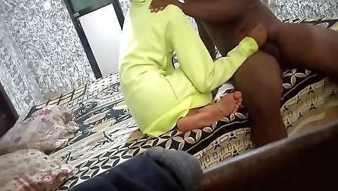 A redhead is in a web cam bed room taking a handjob