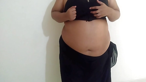 Busty Indian chick shows off her booty and sexy lips